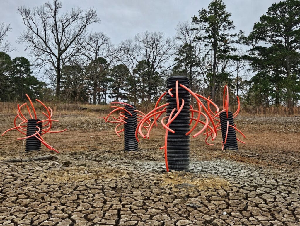 TUBE DUDES: Modified “trees” created using plastic culverts and PVC conduit offer complex cover for gamefish. AGFC photo courtesy of Andy Yung.